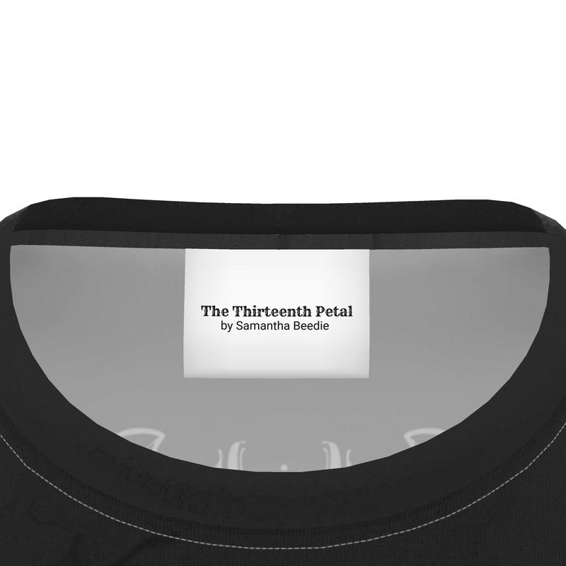 The Thirteenth Petal label inside a black t-shirt