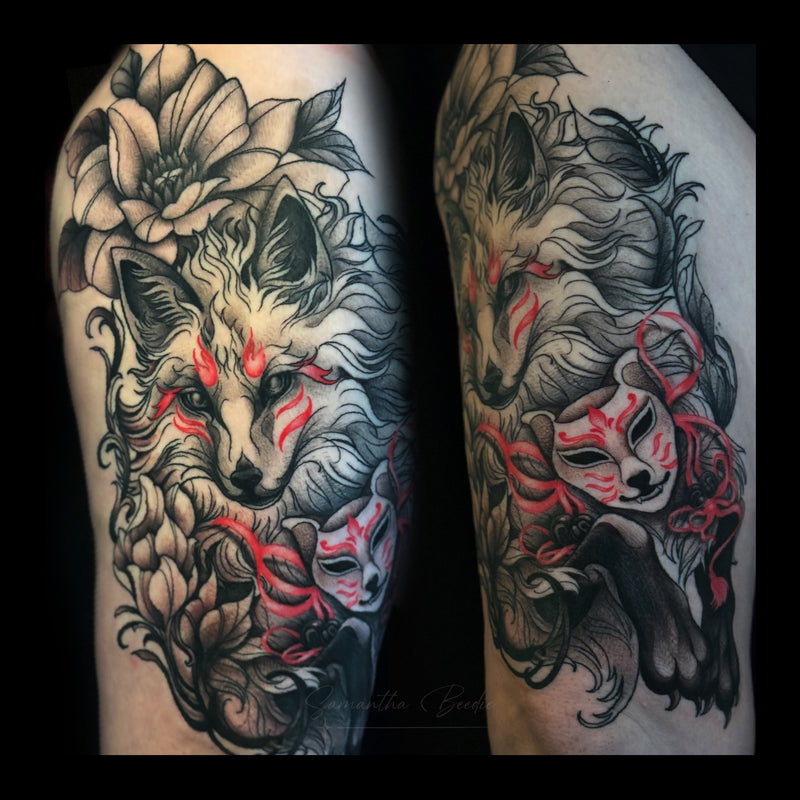 A Japanese Kitsune fox tattoo done on the upper leg, in black and grey with red ink accents