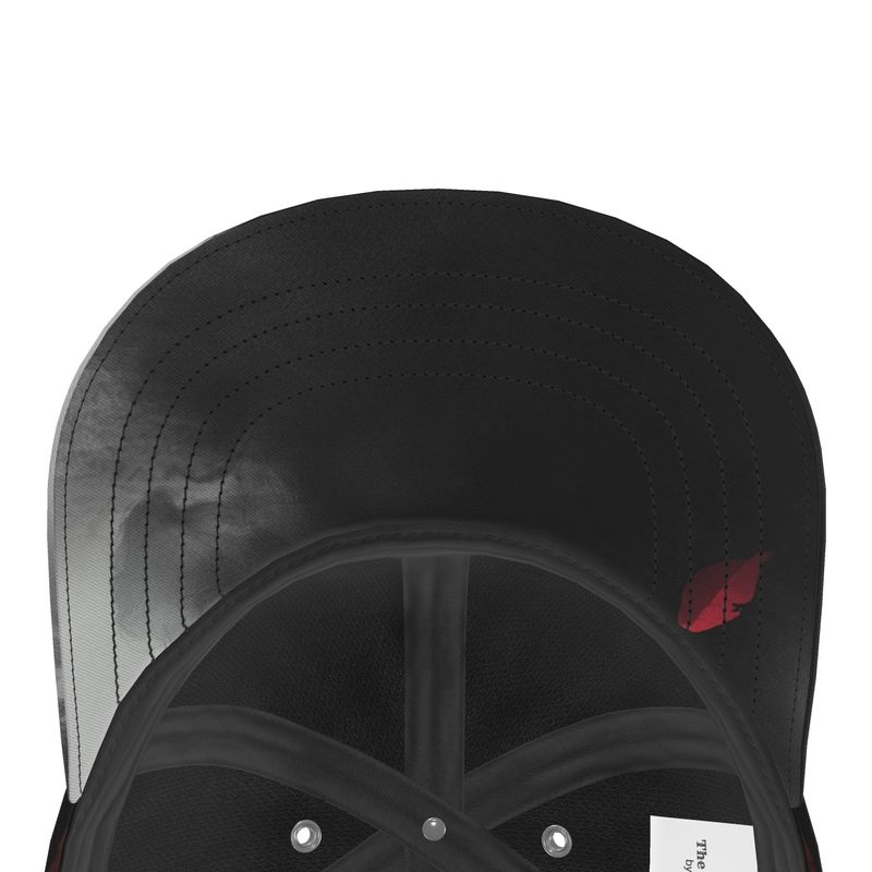 The underside peak of a base  ball cap with the red petal smoke design on