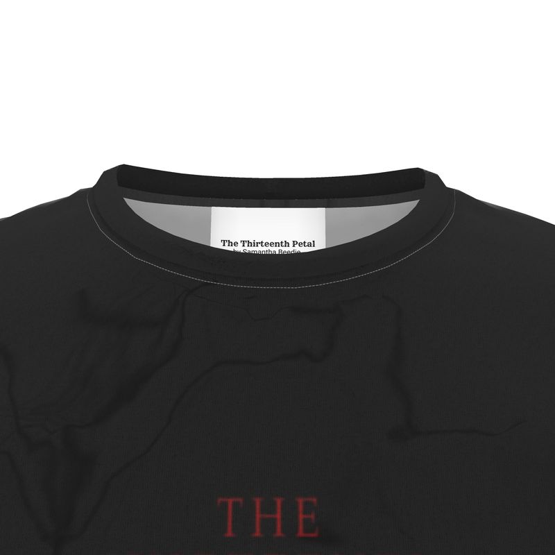 The close up of a black t-shirt collar the the thirteenth petal brand name on